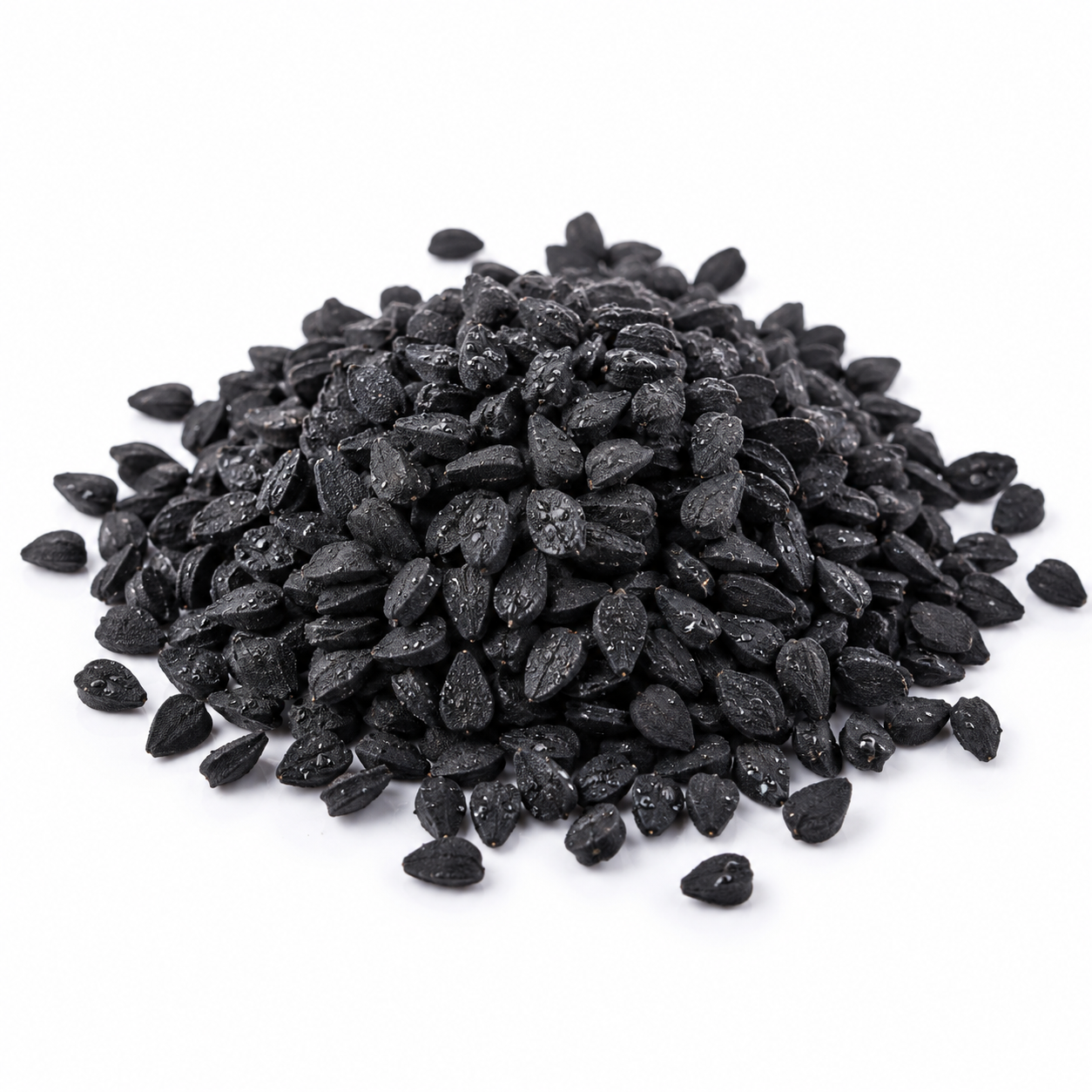 Pile of black seeds on a white background