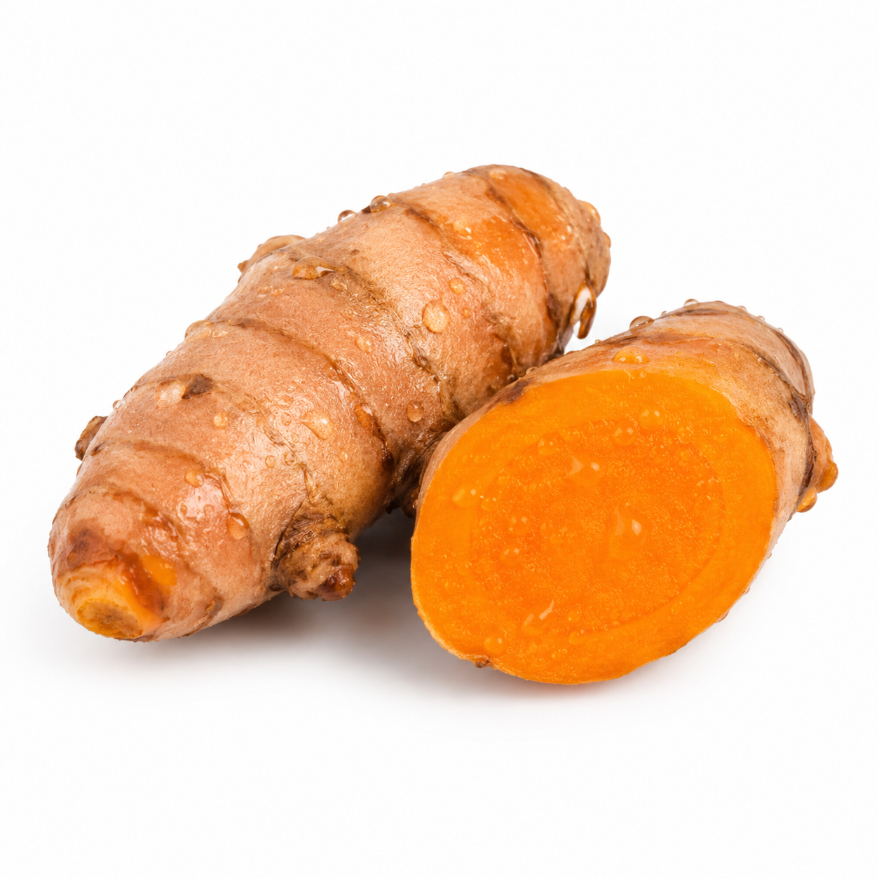 Turmeric root with a cut half showing bright orange interior on a white background