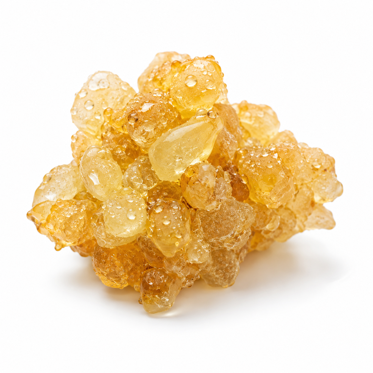 Cluster of amber-colored crystals on a white background
