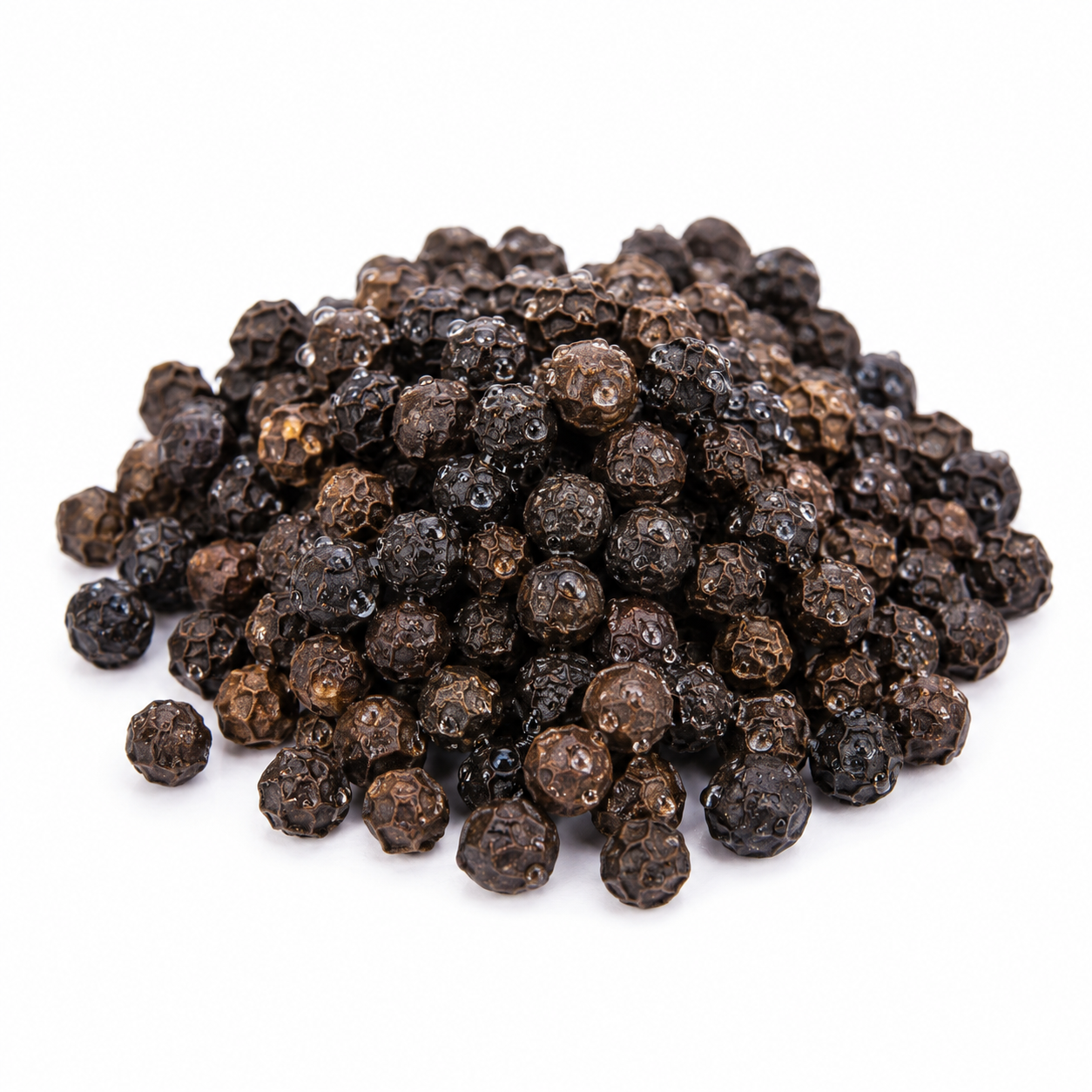 Pile of black peppercorns on a white background