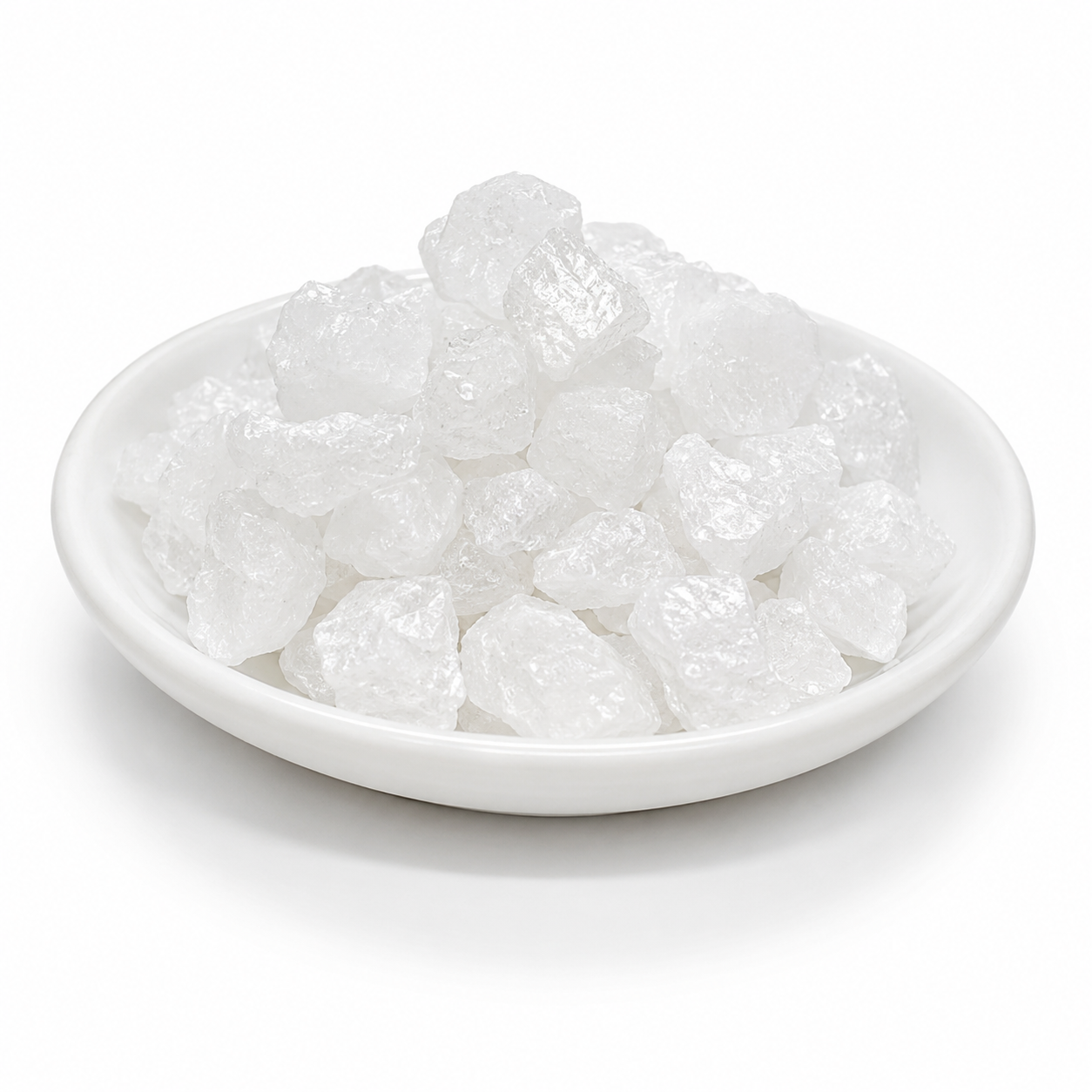 White stones in a white bowl on a white background